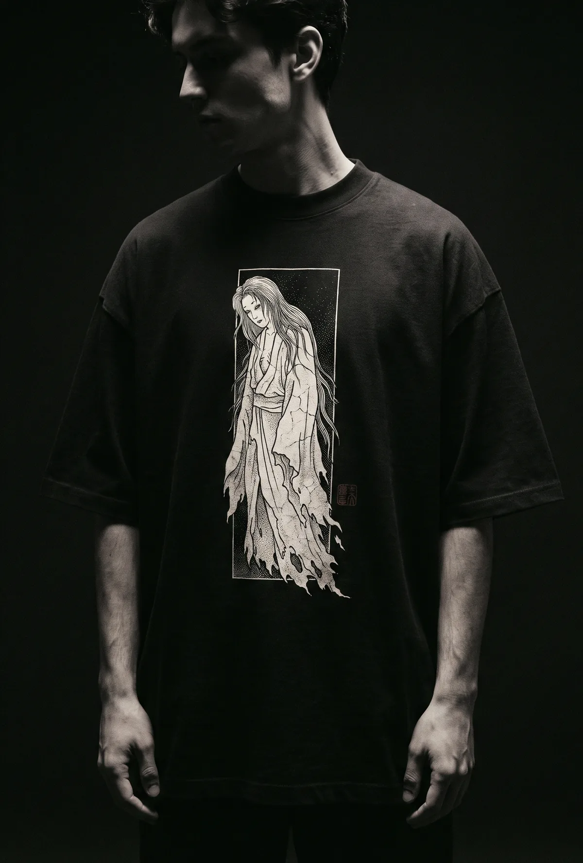 Model wearing the IKITAI Yūrei Oversized Tee in black 280GSM cotton, woodblock ghost engraving printed on the chest